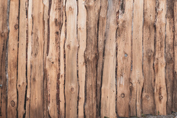 Fence made vertical wooden planks, pine wood, pipe texture surface, vintage background with place for text, poorly processed timber.