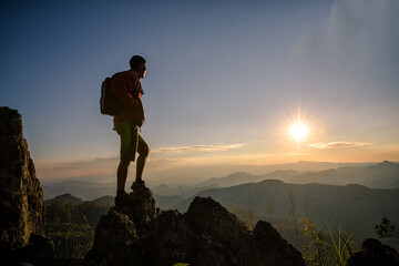 Young man tourist with backpack relaxing