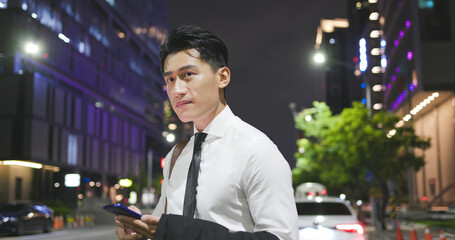asian businessman call the taxi