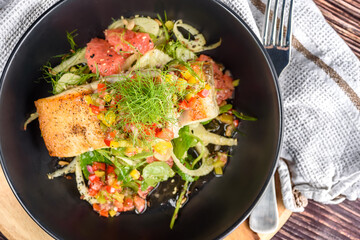 Grilled barramundi with fennel, pink grapefruit, pea tendrils and salsa verde