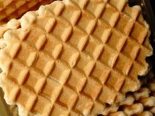 A sweet waffle like a Belgian one. Closeup.