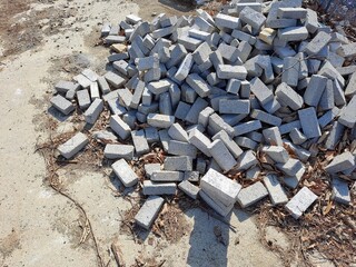 Gray bricks stacked on a construction site