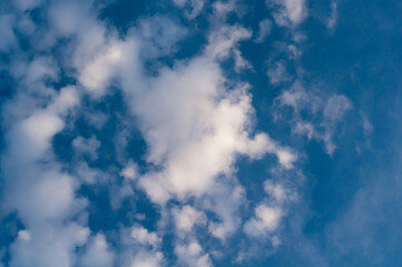 Fototapeta premium White translucent cloud against blue sky. Outdoors.