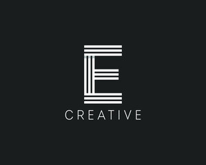 Letter E lines logo design. Interwoven white stripes with a shadow isolated on the background. Vector design template for emblems, monograms, cards, personal initials, corporate identity, brand name.
