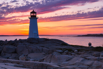 A dramatic sunset at Peggy's Cove Lighthouse Atlantic Coast Nova Scotia Canada. The most visited...