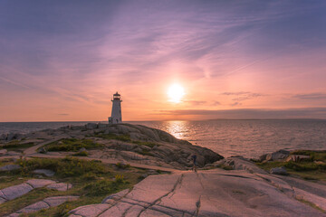 A grand sunset at Peggy's Cove Lighthouse Atlantic Coast Nova Scotia Canada. The most visited...