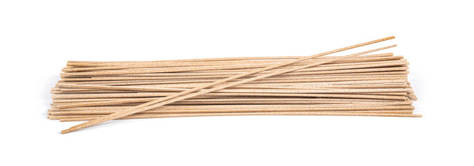 Bundle of buckwheat soba noodles isolated on white.