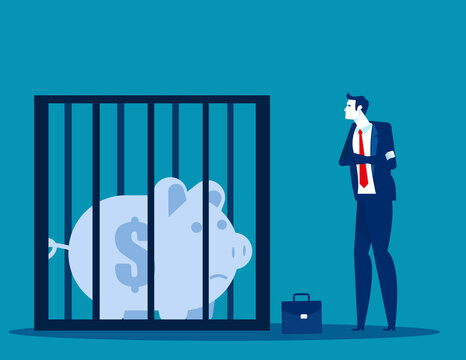Businessman looking at a piggy bank in a cage