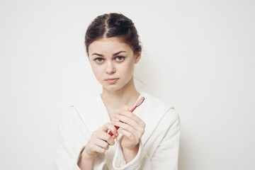 Woman in white coat toothbrush hygiene dental care