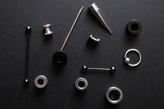 metal piercing on dark gray background closeup