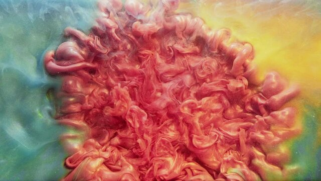 Color splash. Paint drop in water. Smoke cloud animation. Vibrant coral red glowing fluid spreading center opener effect in blue orange glitter mist dynamic texture abstract background.