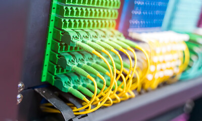 green optical patch cords inserted into the green optical ports, professional external device for...