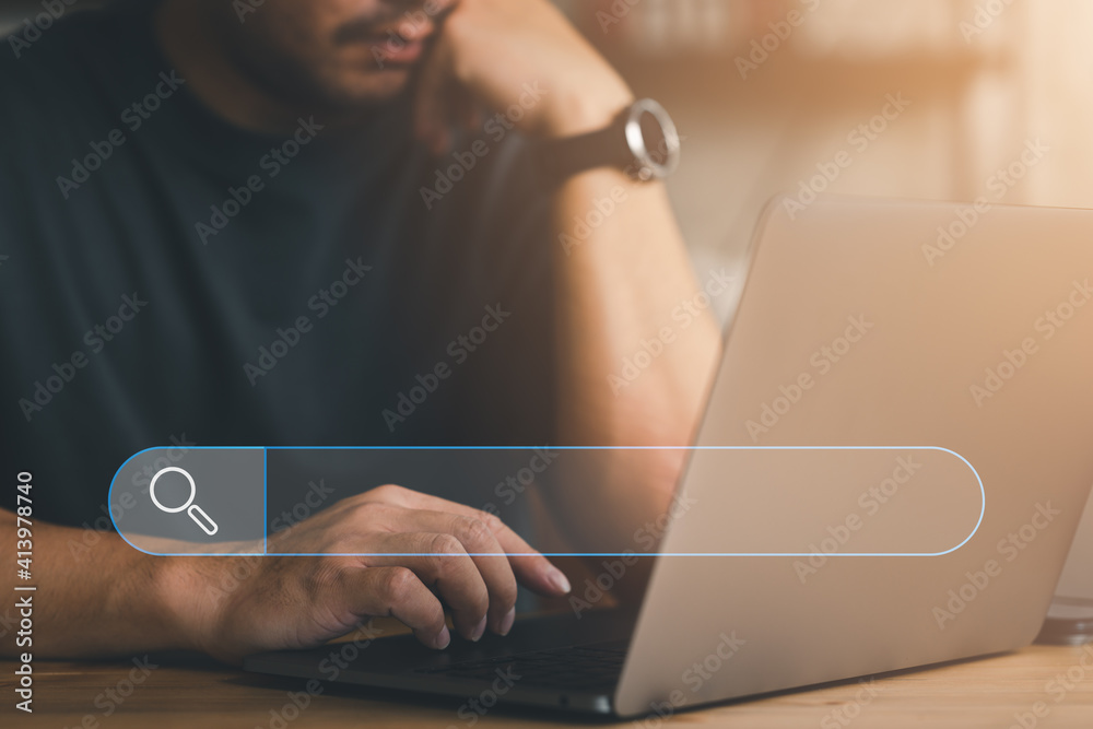 Fototapete Data Search Technology Search Engine Optimization. man's hands are using a computer notebook to Searching for information. Using Search Console with your website.