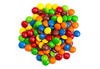 Pile of Rainbow Colored Candy Coated Chocolate Buttons Isolated on a White Background
