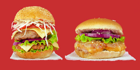 2 juicy burgers on napkins against red background