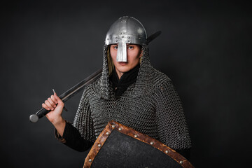 Portrait of a medieval warrior of the late Viking era and the beginning of the Crusades. Knight in...