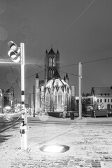 Belfry of Ghent during snowfall in black and white