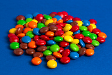 Pile of Rainbow Colored Candy Coated Chocolate Buttons