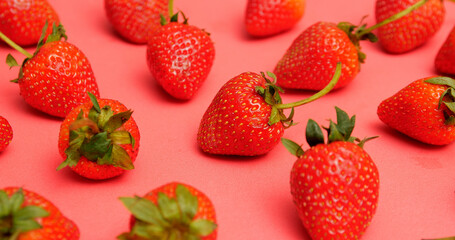 Close up, Bright red and sweet ripe many strawberries on red background.