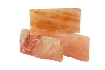 Red, pink, yellow, brown, himalayan salt blocks bricks on isolated white desk