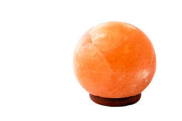 Red, pink, yellow, brown, himalayan polished salt sphere lamp on isolated white desk