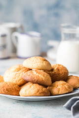 Freshly baked homemade crunchy cream cheese cookies. A delicious treat for gourmets. Biscuits on a grey concrete background. Biscuit.  Biscuits texture
