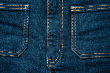 Fototapeta premium Blue jeans denim front pockets. Close up photo.