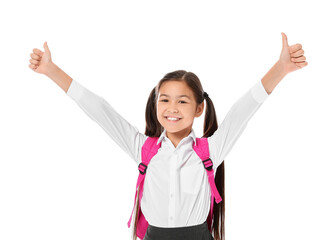 Little schoolgirl showing thumb-up gesture on white background