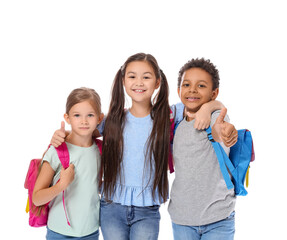 Happy little schoolchildren on white background