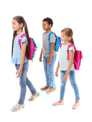 Obraz premium Little schoolchildren on white background