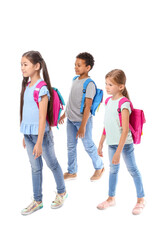Obraz premium Little schoolchildren on white background
