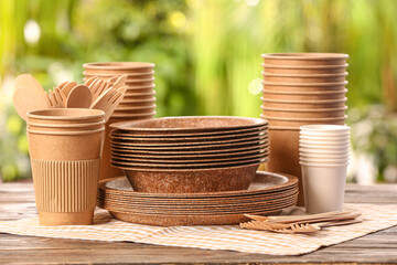 Eco tableware on table against blurred background