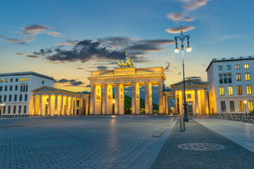 Berlin Germany, sunset city skyline at Brandenburg Gate (Brandenburger Tor) © Noppasinw
