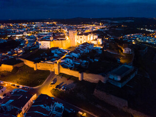 Obraz premium Night aerial view of medieval castle of Estremoz in Portuguese civil parish of Santa Maria de Devassa