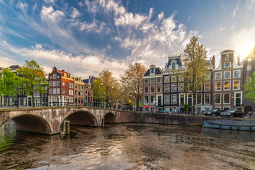 Amsterdam Netherlands, sunset city skyline of Dutch house at canal waterfront