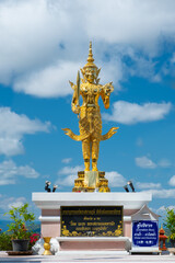 CHIANG SAEN,CHIANG RAI,THAILAND - FEBRUARY 9,2021 :Buddha image at Wat Phra dhat pha ngao and blue sky with clouds ,Chiang sean Thailand.