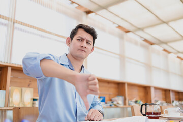Fototapeta premium Business man show thumbs down