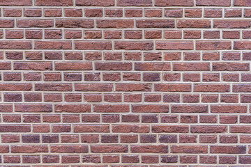Red-brown brick wall as background