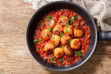 pan of meatballs with tomato sauce, top view