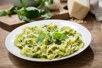 plate of pasta with pesto sauce