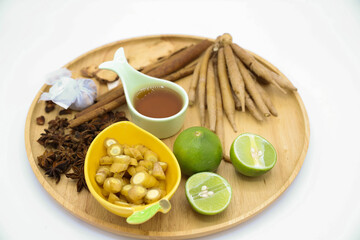 Lemon honey and spices used in cooking Placed on a wooden tray