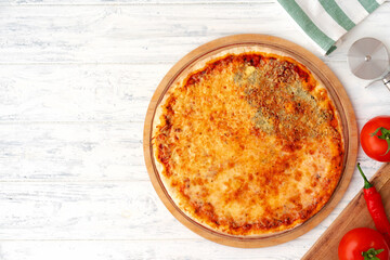 Pizza with four cheeses served on wooden background