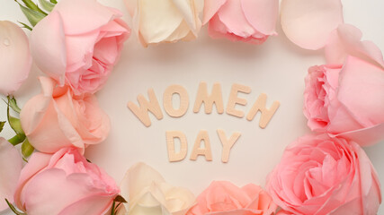 Women's Day message with pink roses decorated on white background
