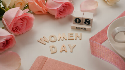 8 March Happy Women's day on white background decorated with pink flowers and ribbon