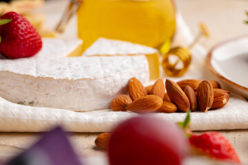 Cheese with nuts and strawberry close up