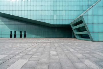 Fototapeta premium The empty floor of the square and the exterior walls of modern buildings