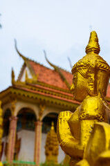 Fototapeta premium The view of the golden statue in Cambodia.