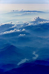 Aerial Photography of Blue Foggy Mountains with Clouds and a River