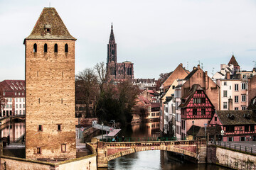 Fototapeta na wymiar Buildings in Strasbourg and A Bridge With a River