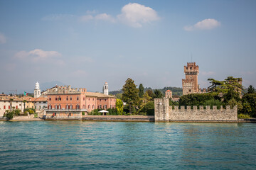 Obraz premium View of Sirmione from Lake Garda. Autumn sunny evening. Sirmione, Lombardy, Italy